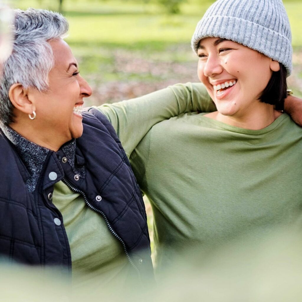 How to harness the power of thoughts: two women talking and smiling